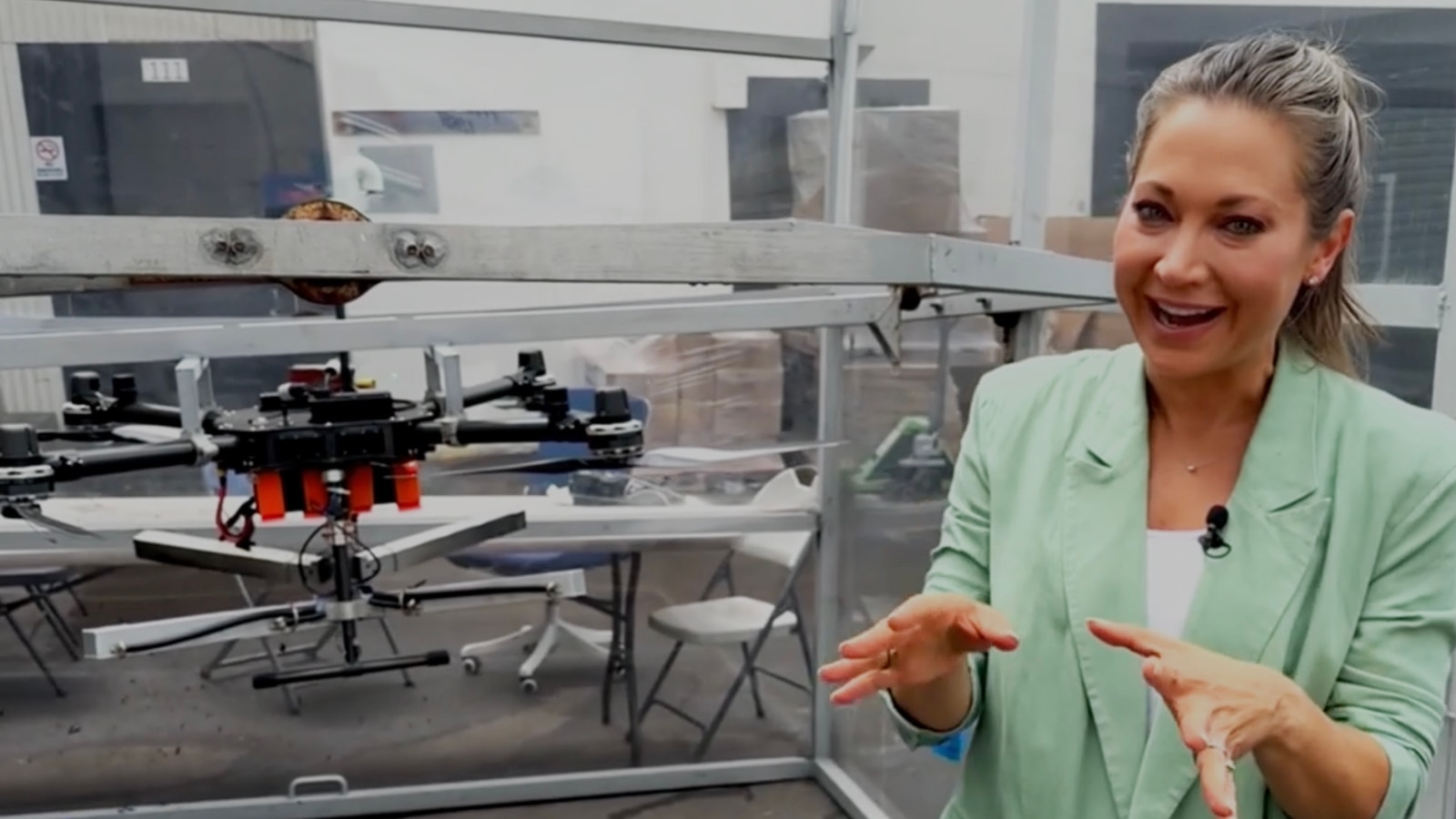 ABC News reporting beside a Rainmaker cloud-seeding drone